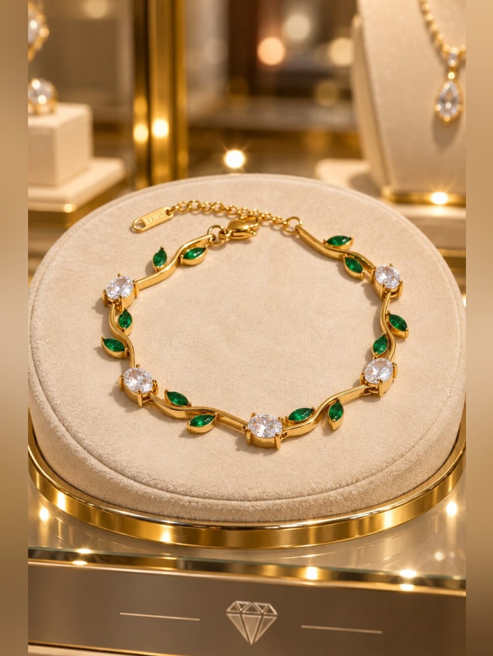 Gold Bracelet with Green Leaf Accents and Clear Stones